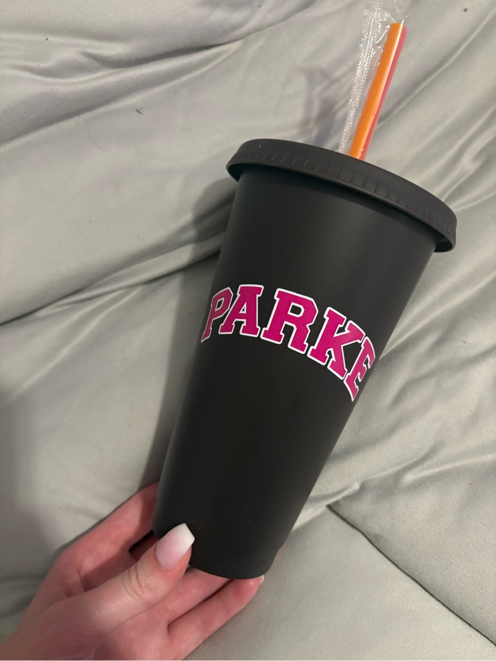 Black and pink PARKE Dunkin reusable cup